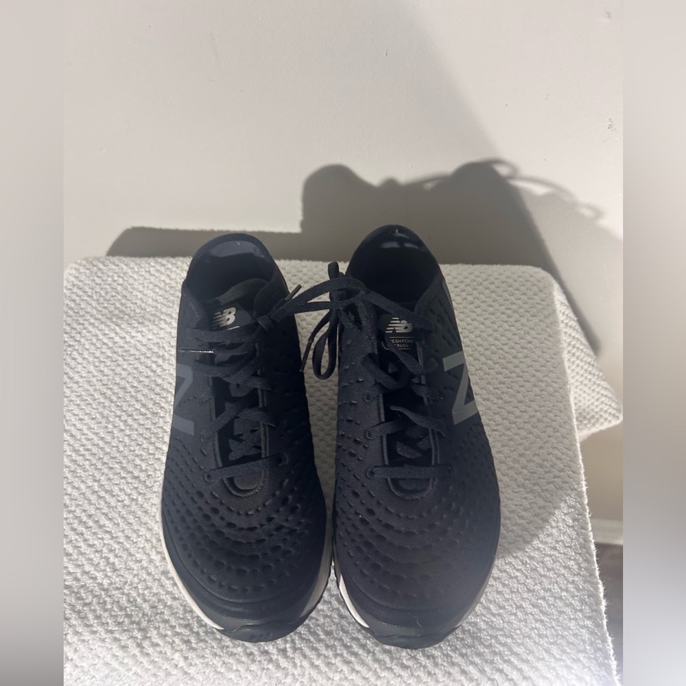 New Balance women’s  Black and White Sneakers
